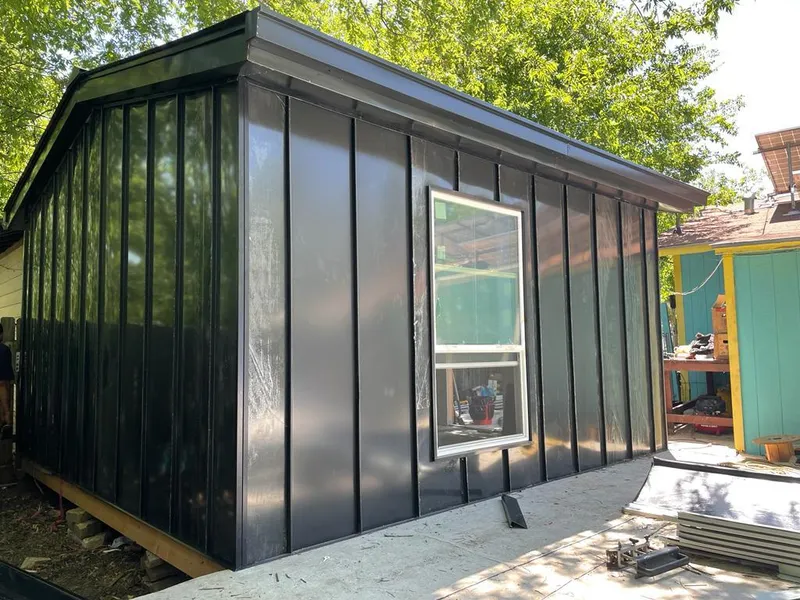 Black standing seam metal wall panels for Roof Inspection in Amelia